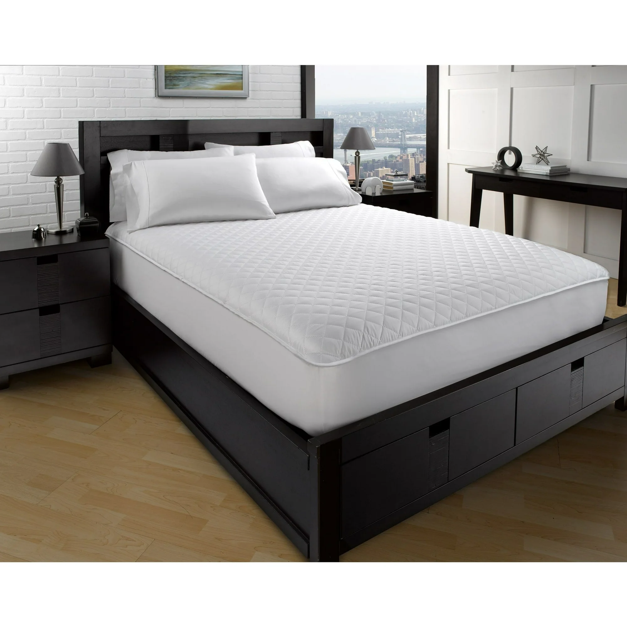 Plush mattress topper on a bed in a modern bedroom.