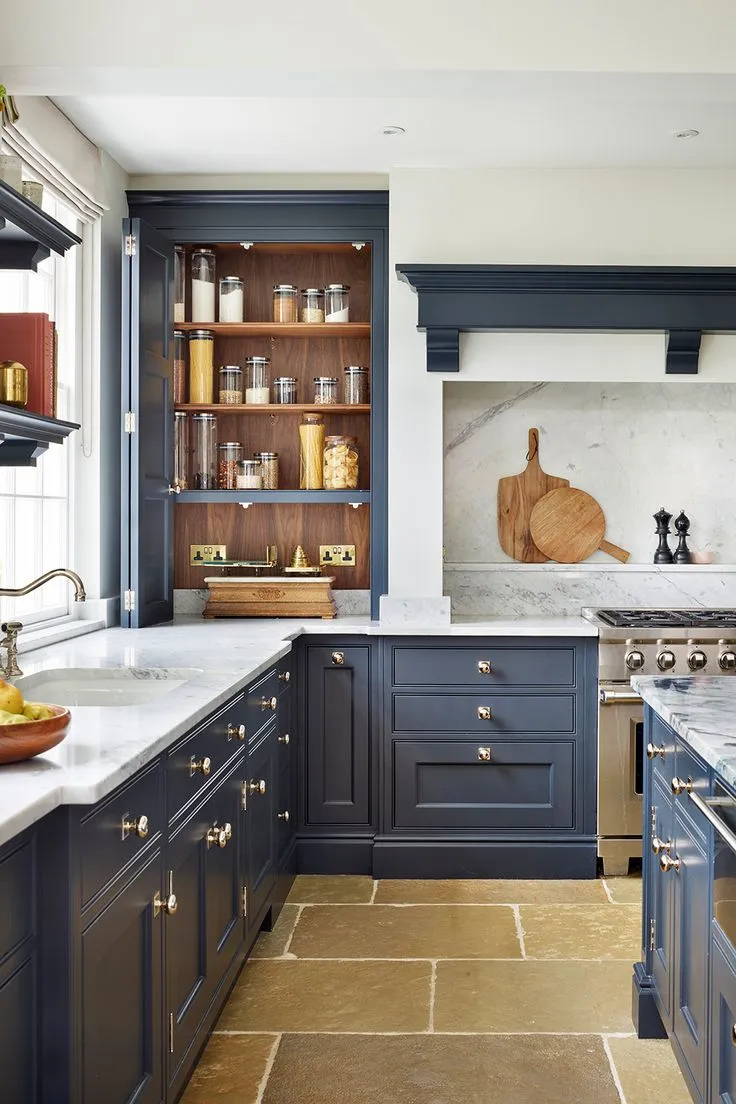 U-shaped kitchen with navy blue cabinetry