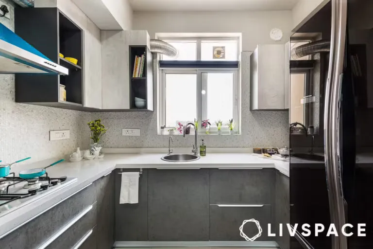 Modern U-shaped kitchen with grey and white cabinetry