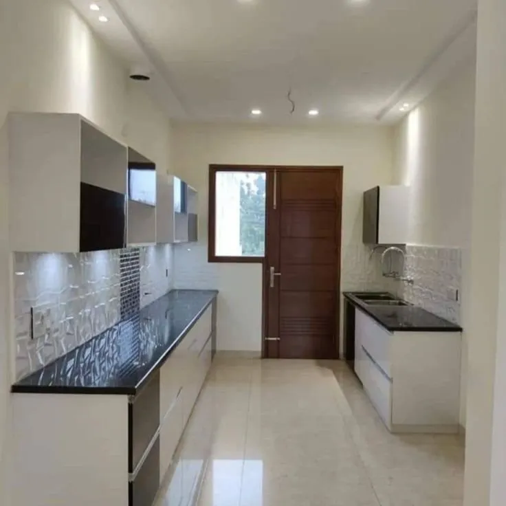 Modern parallel kitchen with white and black cabinetry