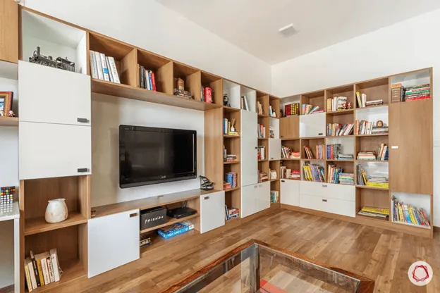  1 BHK design: Bookshelf, TV unit, storage.