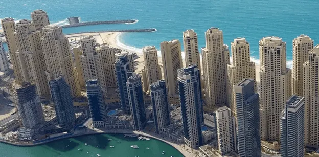 Cityscape with skyscrapers and waterfront.