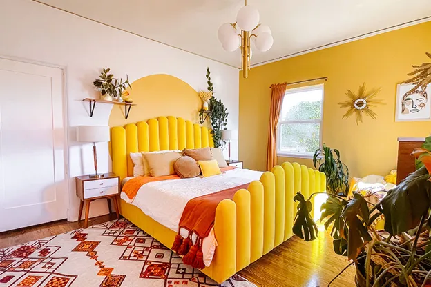 Vibrant bohemian bedroom wall color combination with a bold yellow and orange theme.