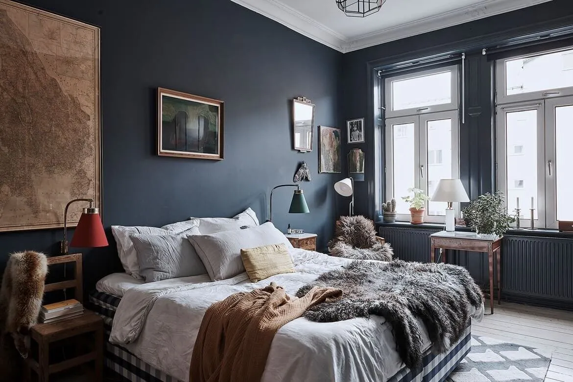 Dark blue cozy bedroom with rustic and Scandinavian elements