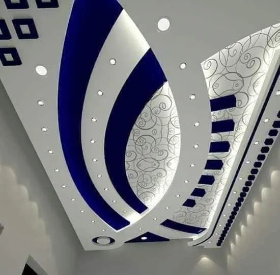 Ornate false ceiling design with blue accents and lighting.