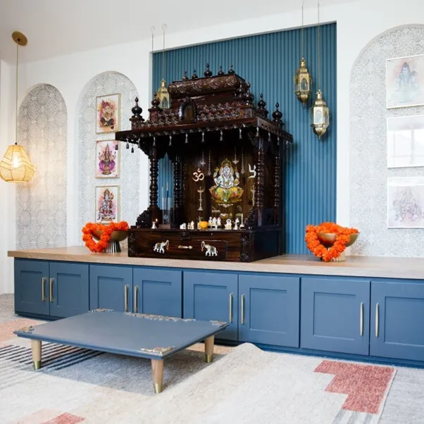 Modern Mandir design for home with blue cabinets.