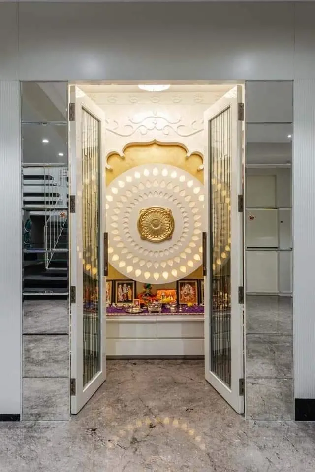 Hindu Pooja Room, circle backdrop, doors, marble, mirrors, shelves.