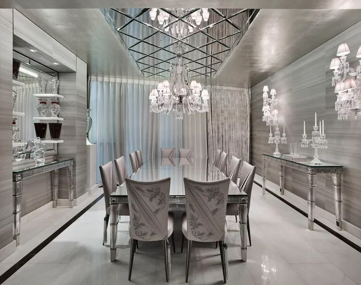 Mirrored false ceiling design in elegant dining room.