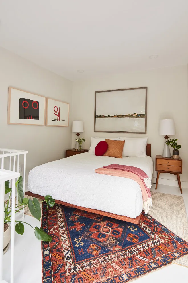 Modern bohemian bedroom with warm tones and vintage decor.