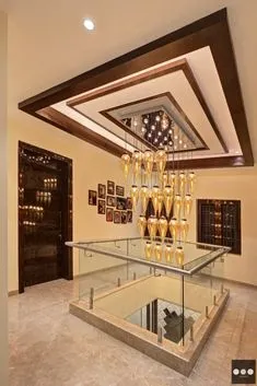 Layered ceiling with modern hall glass railing and light walls