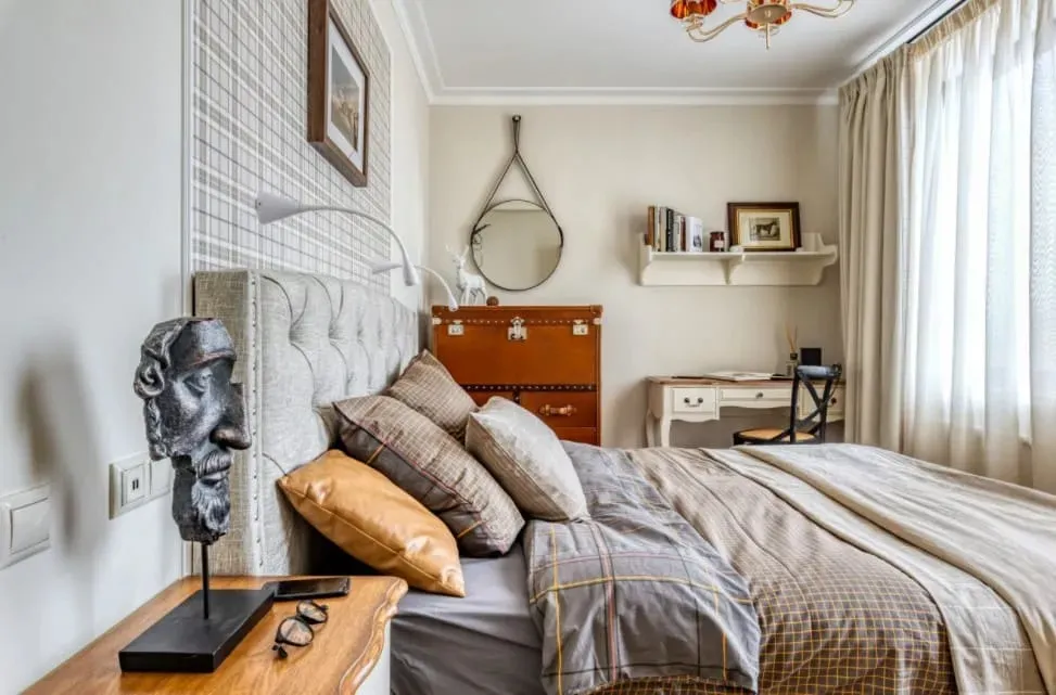 Modern eclectic bedroom with vintage and artistic decor elements.