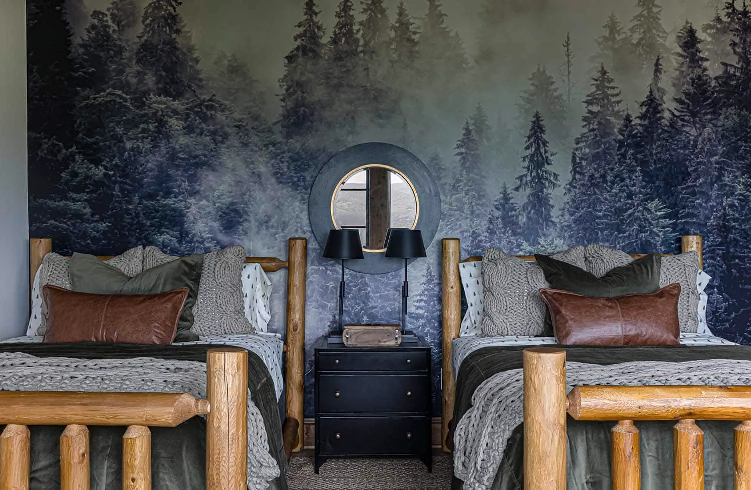 Cozy rustic bedroom with dark blue-gray forest wall mural