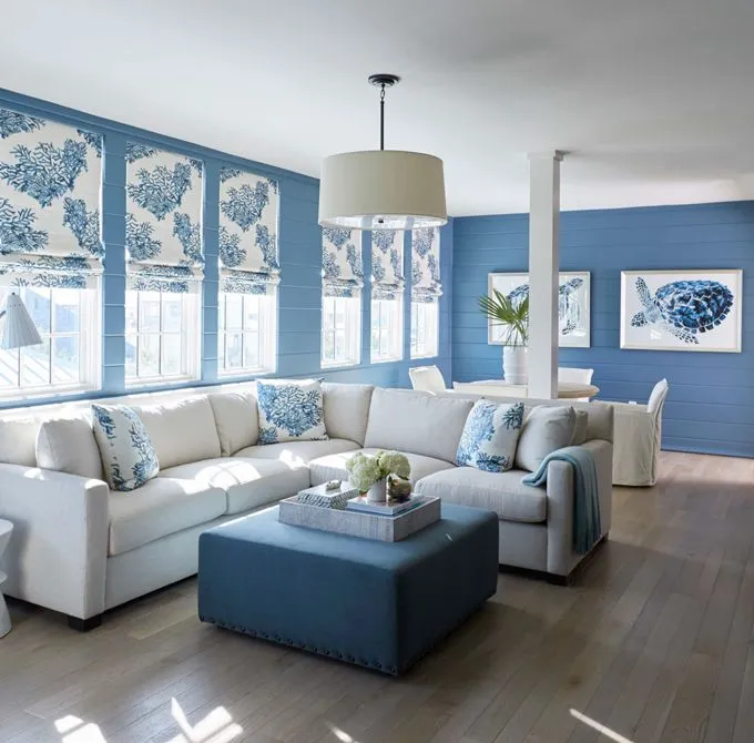 Coastal blue and white living room with soft decor and bright light