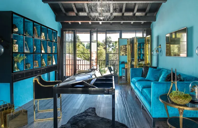 Luxurious home office with bold turquoise walls