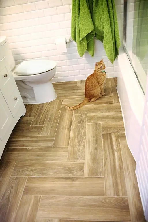 Wood tile bath cat herringbone pattern white subway tiles