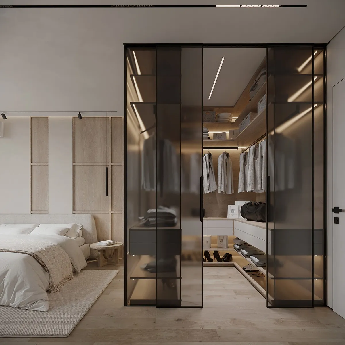 Modern walk-in wardrobe with glass doors integrated into a contemporary bedroom.