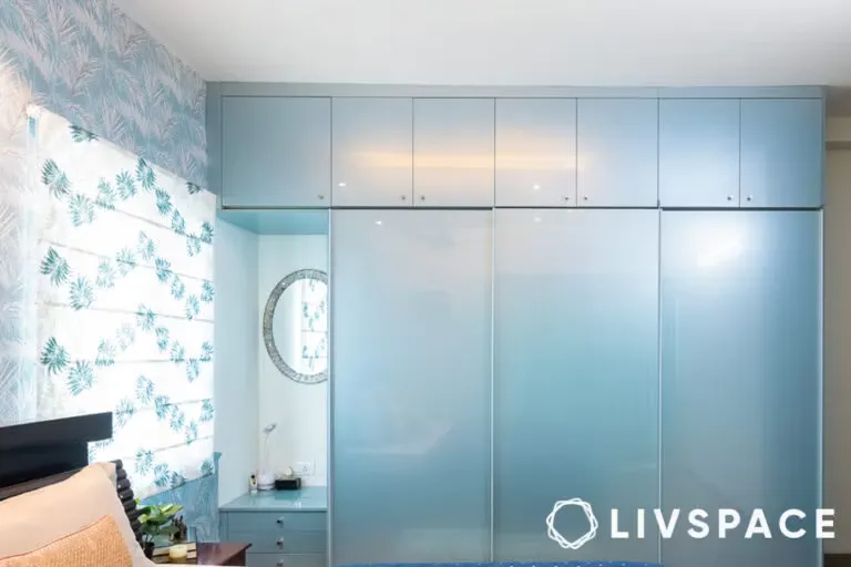 Light blue modular wardrobe with mirrored panels.