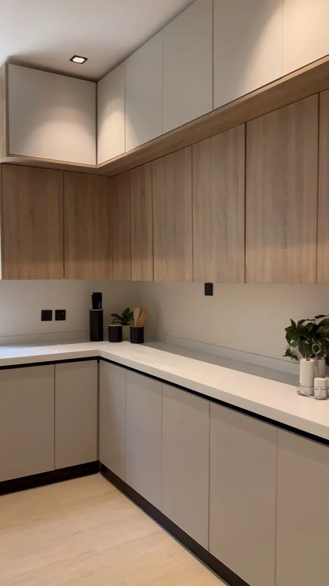 Modern L-shaped kitchen with sleek cabinetry