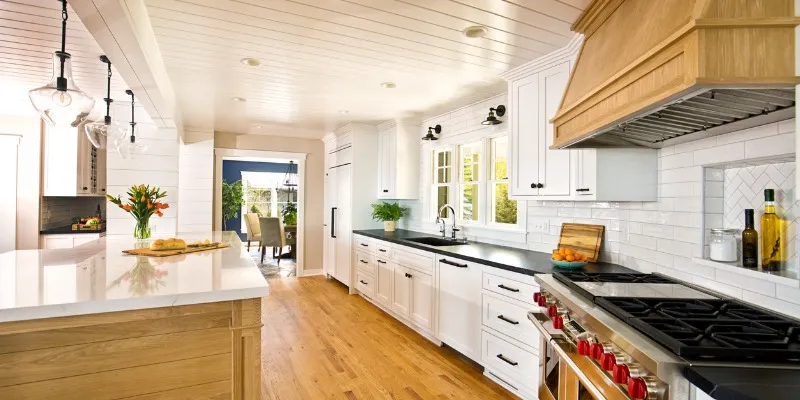 White kitchen interior, island, wood accents, natural light guide.