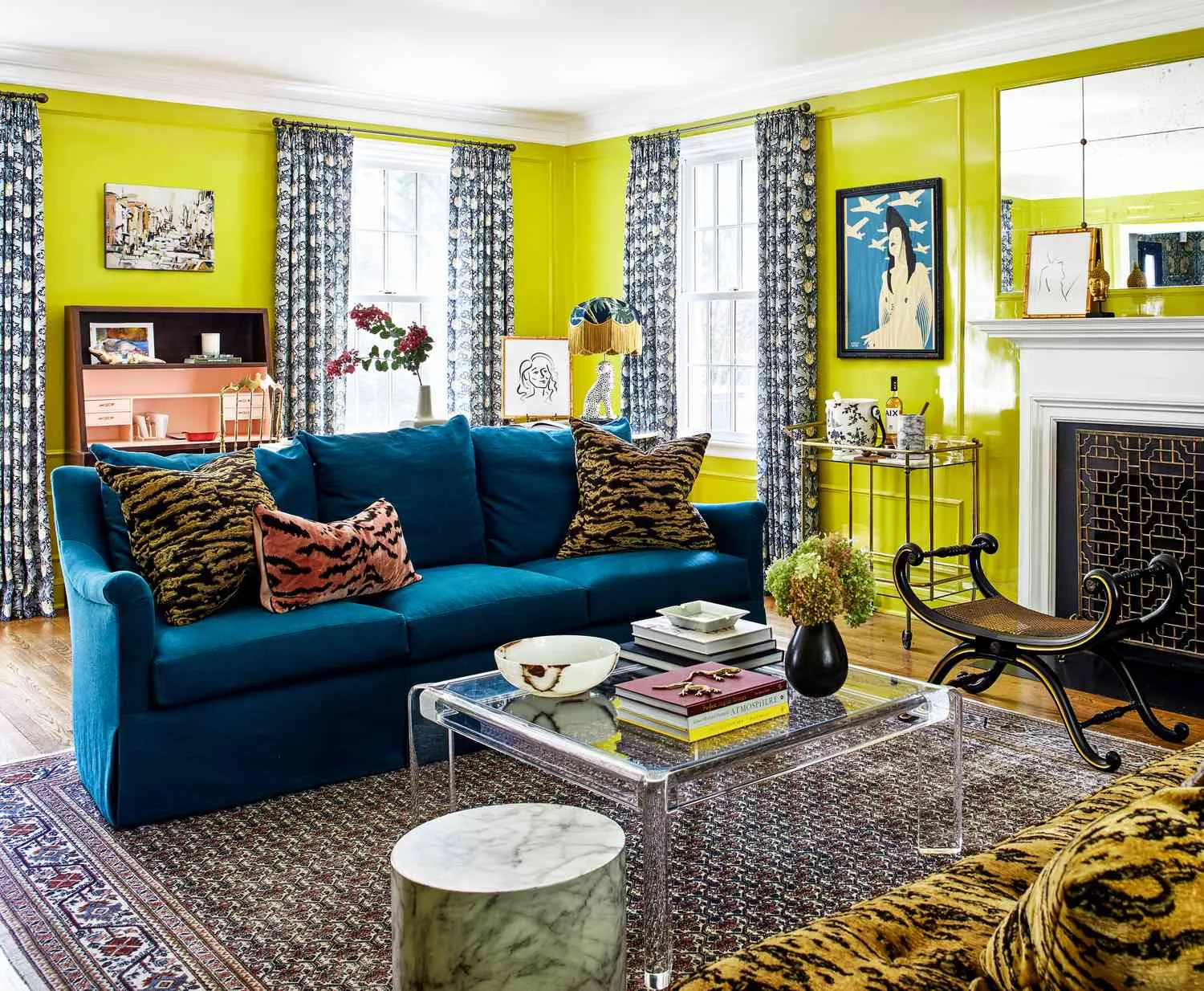 Small living room yellow walls blue sofa pattern rug