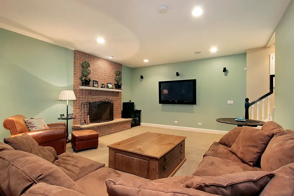  Green basement with brown sofa BASEMENT PAINT COLOR