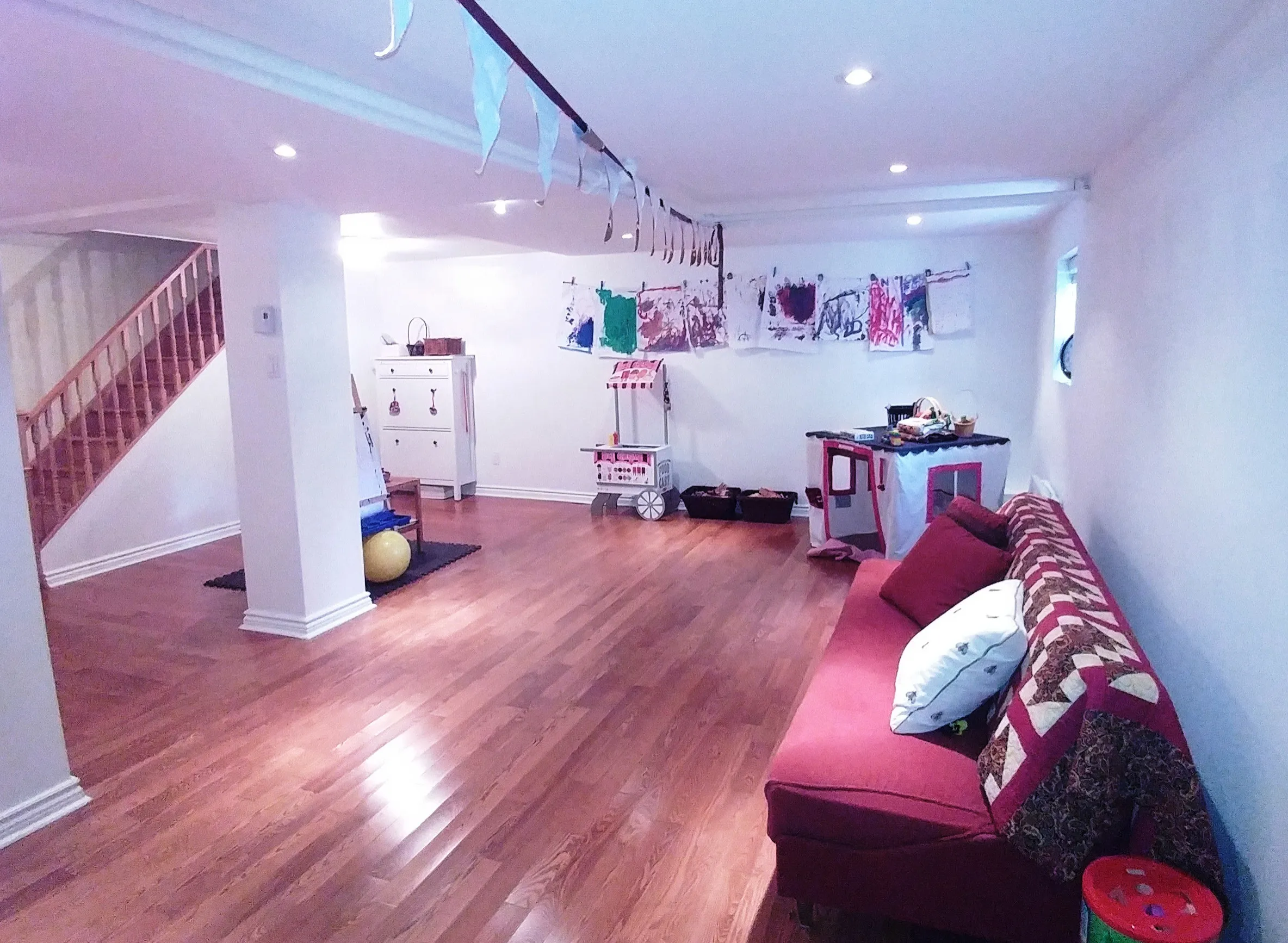 Colorful playroom with red sofa BASEMENT PAINT COLOR