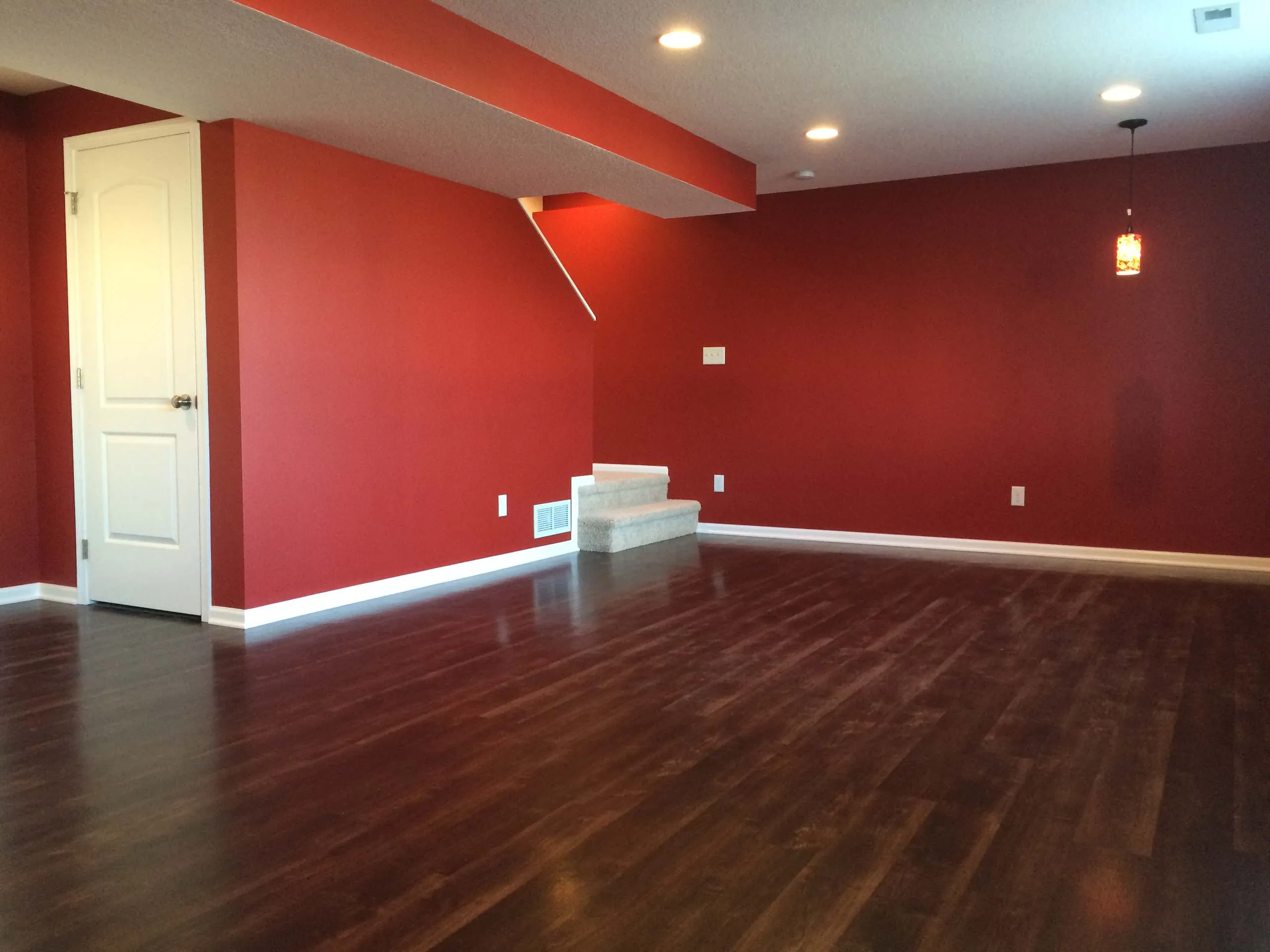  Red painted basement with wood floor BASEMENT PAINT COLOR