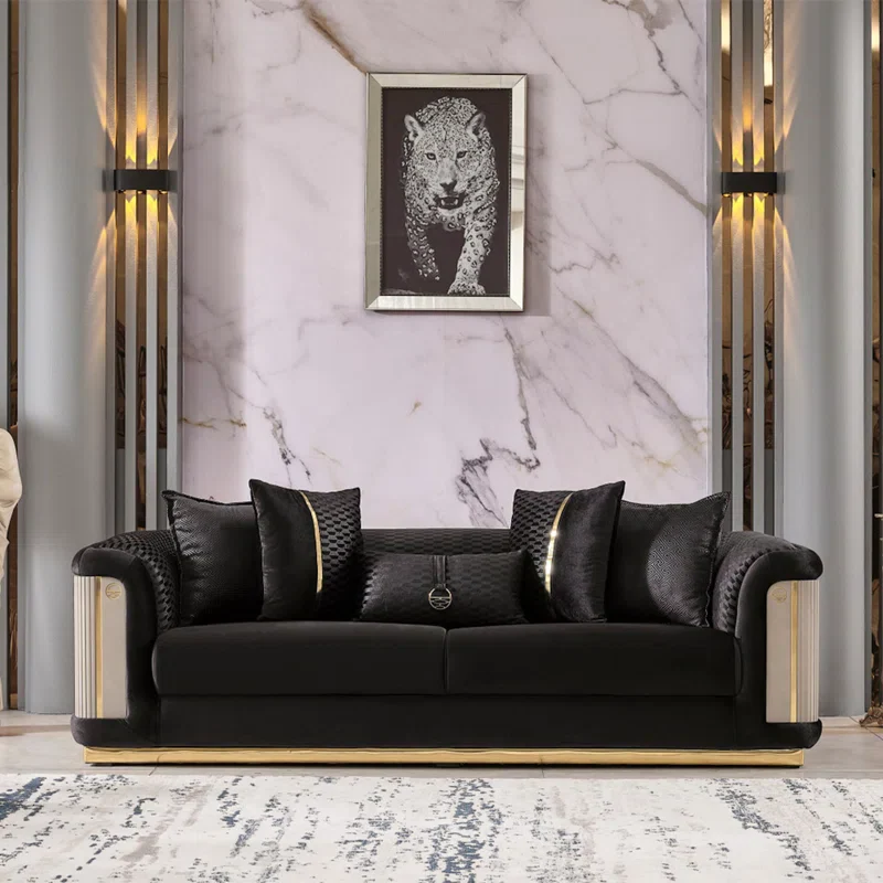 Small living room black sofa gold art marble wall.