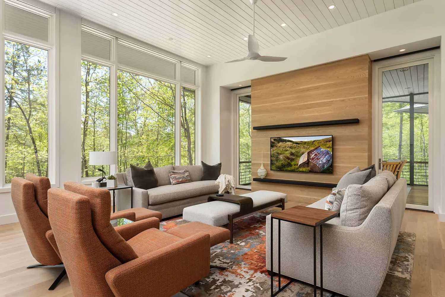 Small living room with wood wall and cozy seating